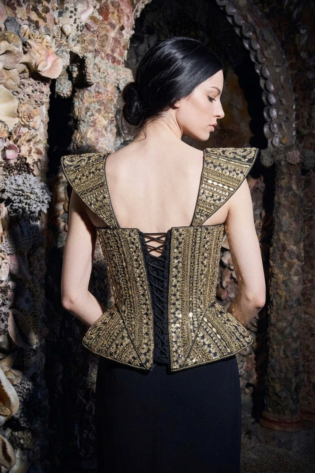 Close-up of mirrorwork detail on gold corset