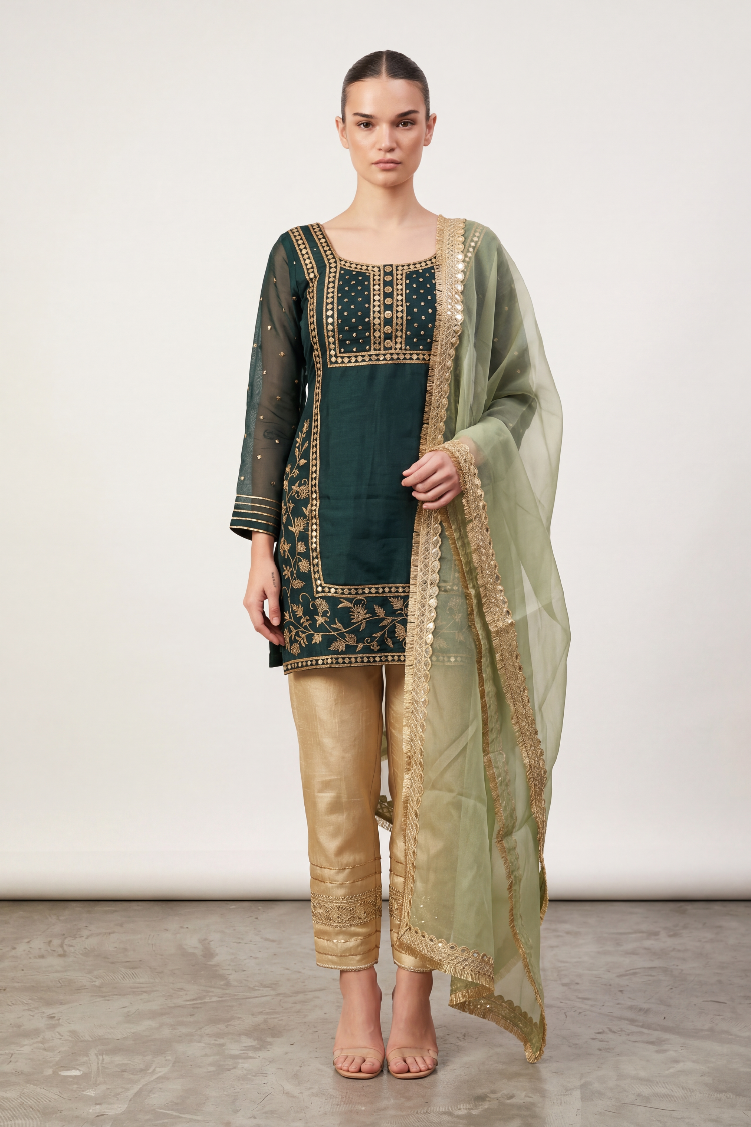 Emerald zari suit by Dorie Atelier — front view