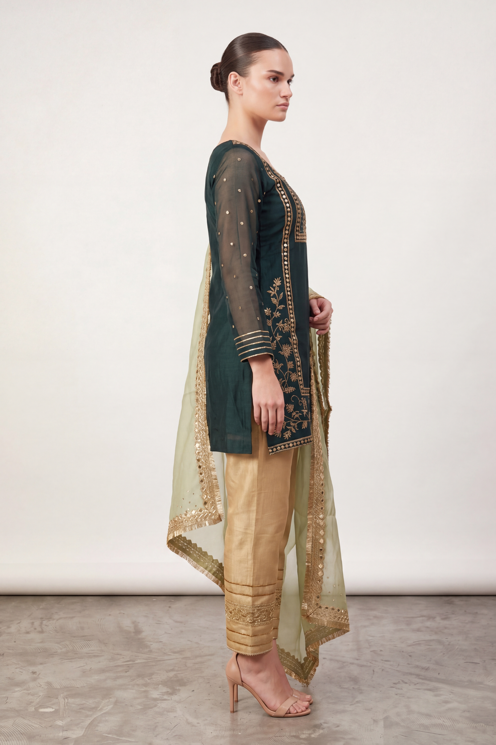 Emerald zari suit — back view showing silhouette and finishing