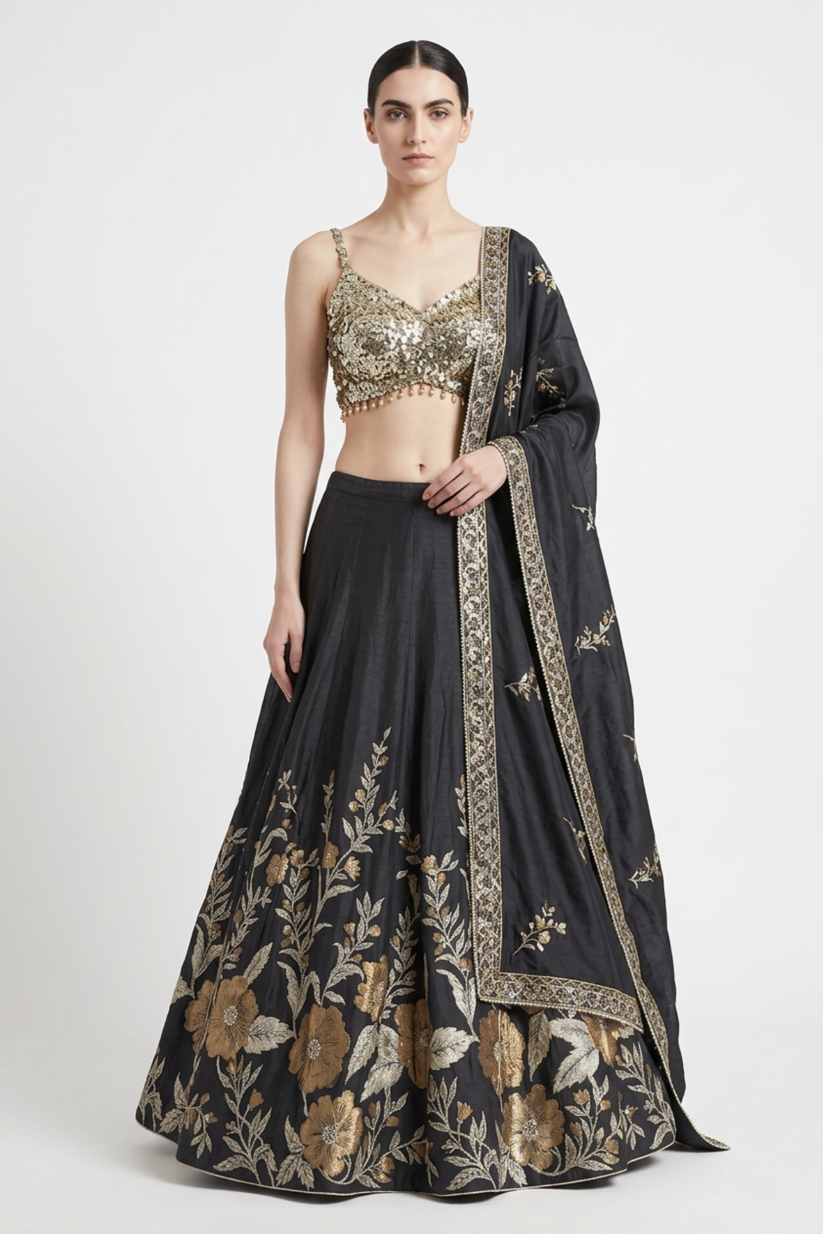 Antique gold silk thread work lehenga by Dorie Atelier — front view
