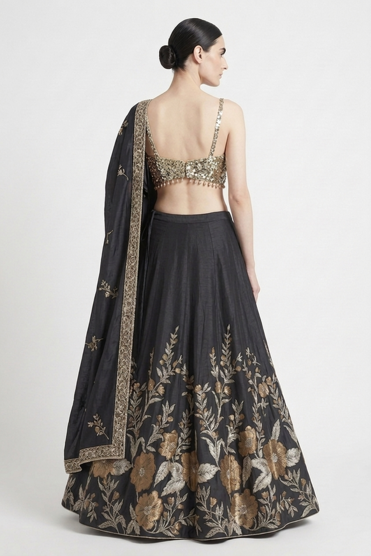 Antique gold silk thread work lehenga — back view showing silhouette and finishing