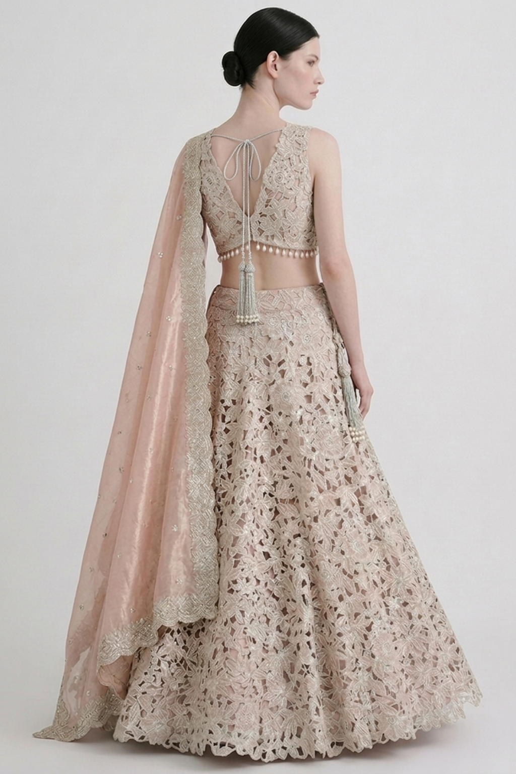 Red silk zardozi lehenga — back view showing silhouette and finishing