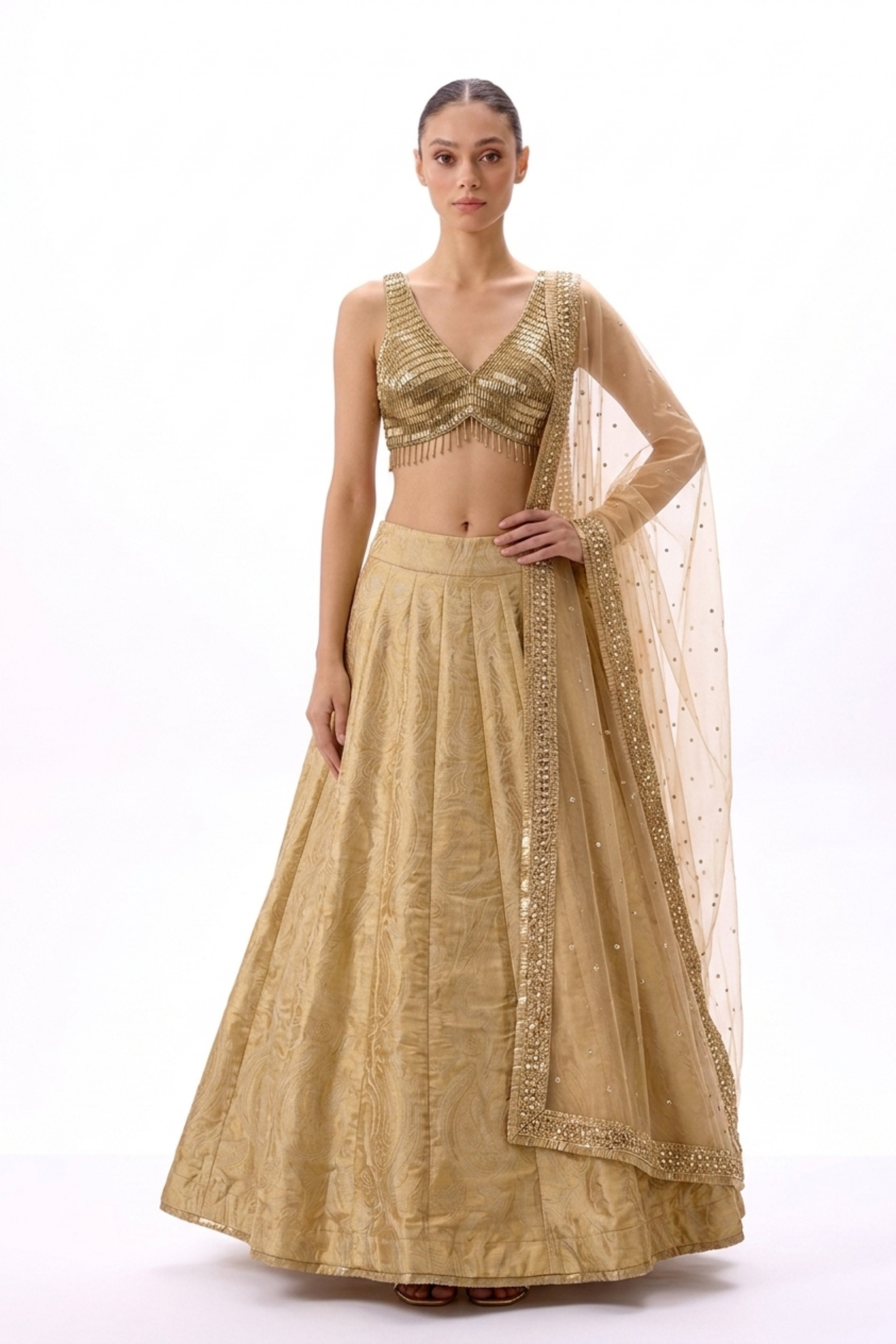 Antique gold net zari lehenga by Dorie Atelier — front view