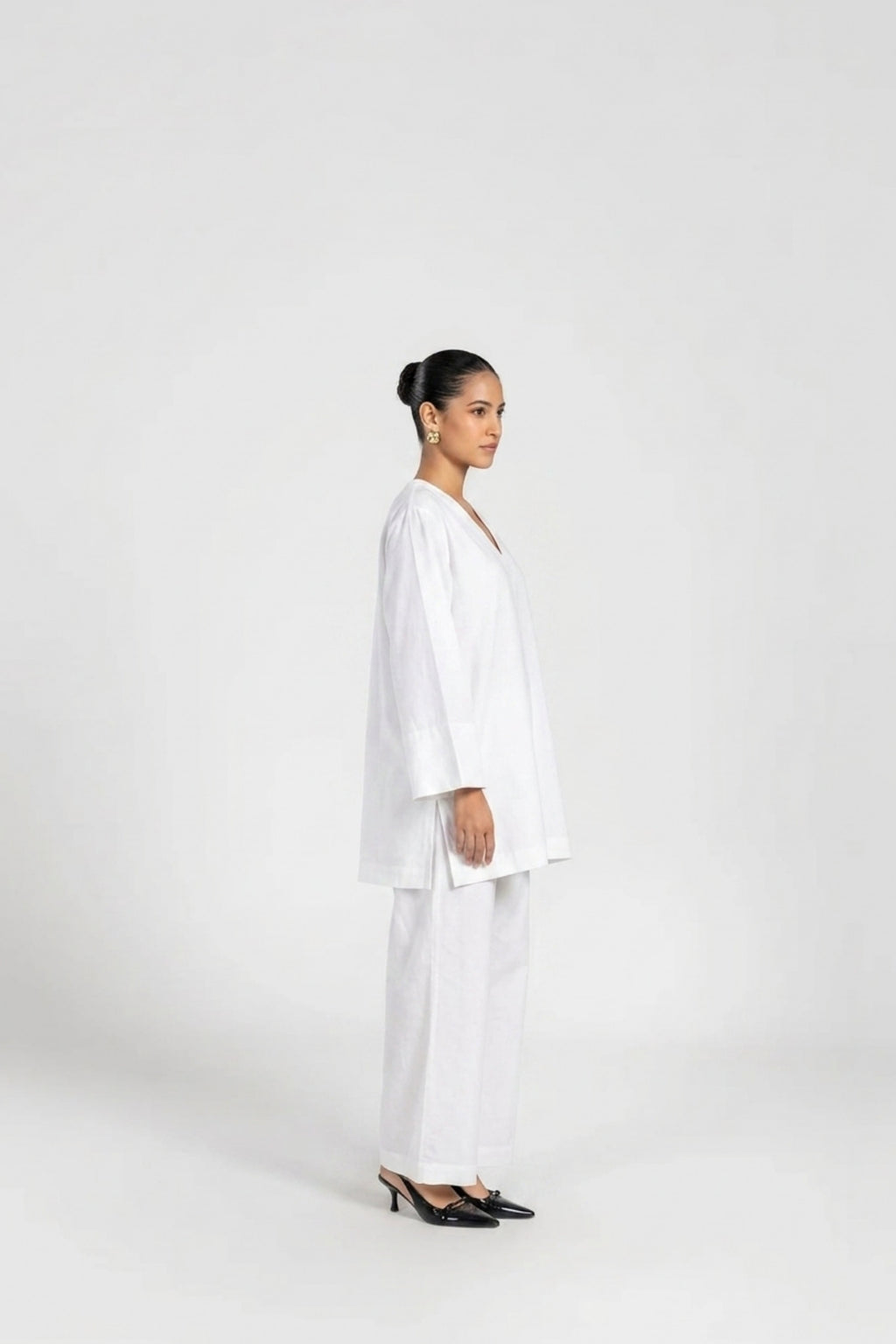 White linen co-ord set — back view showing silhouette and finishing