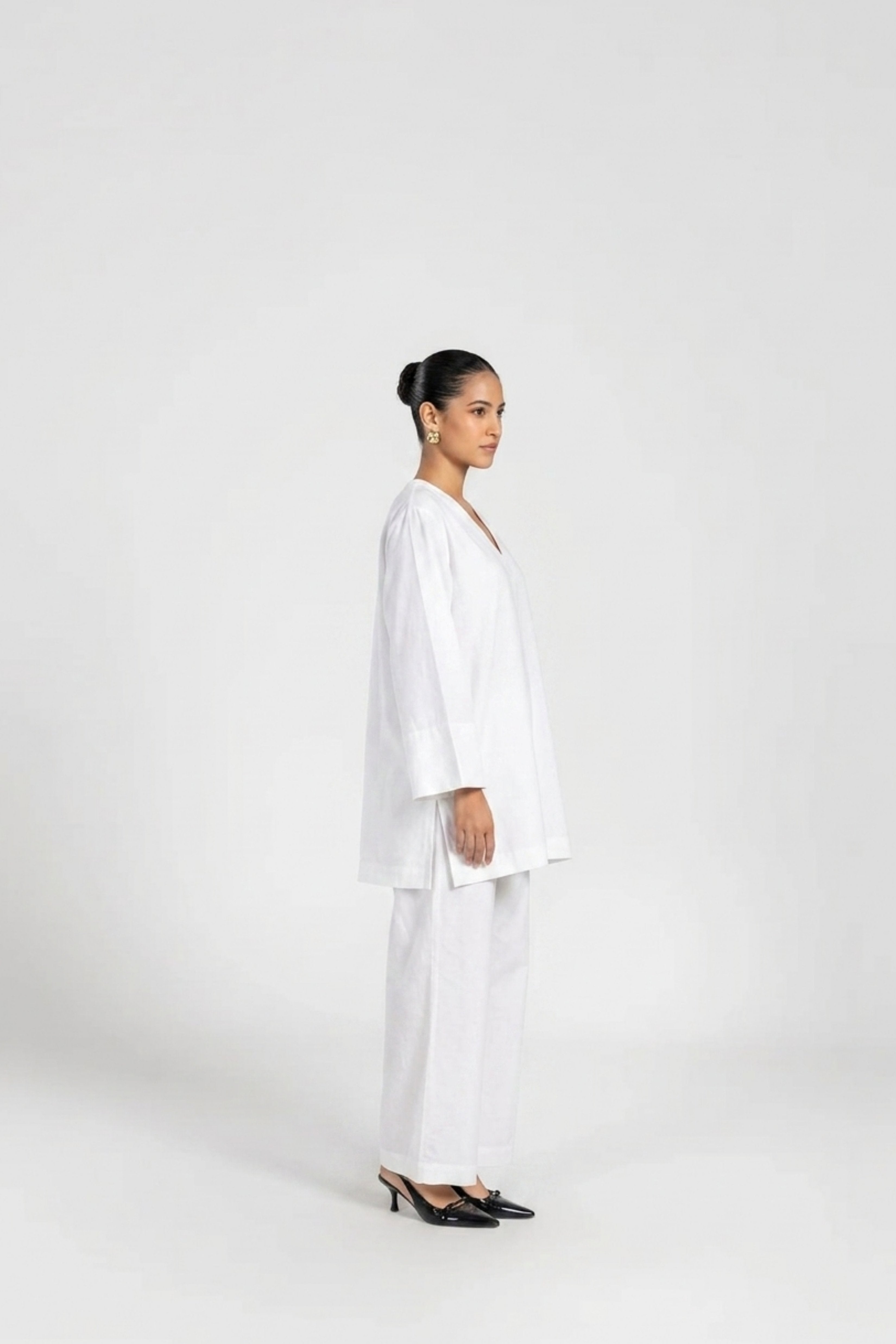 White linen co-ord set — back view showing silhouette and finishing