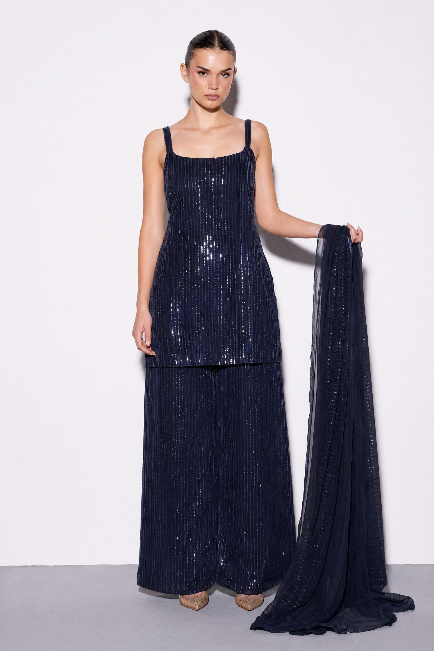 Red sequinned set by Dorie Atelier, evening wear — front view